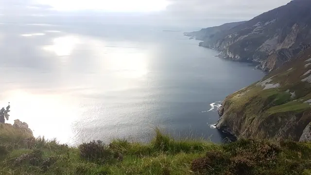 a body of water with hills around it