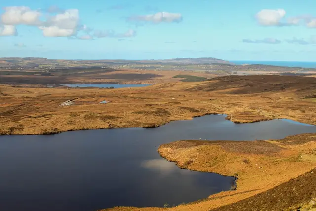a body of water surrounded by land