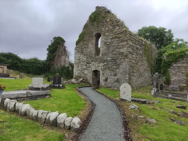 a stone building with a stone walkway