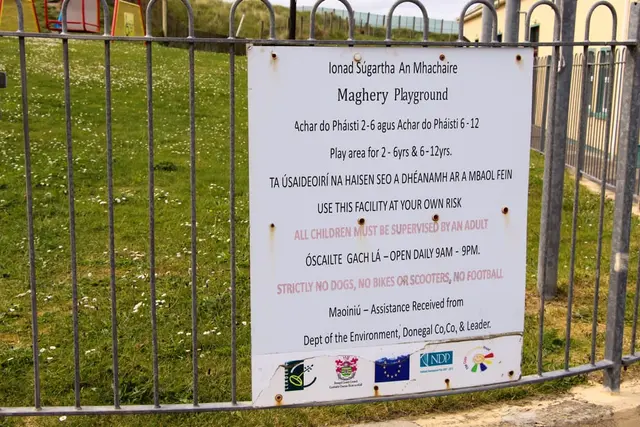a sign on a fence