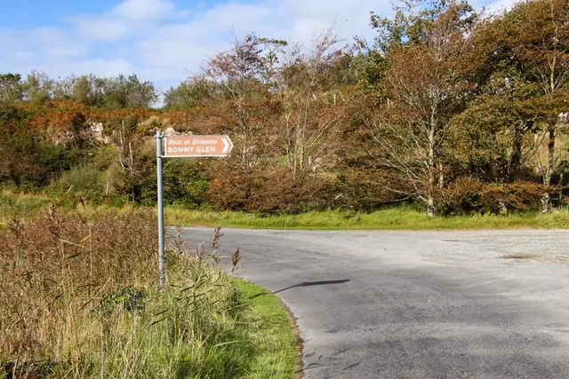a sign on the side of a road