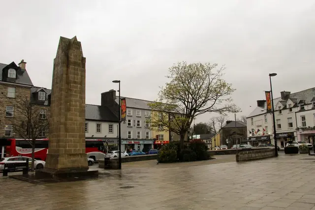 a brick tower in a town