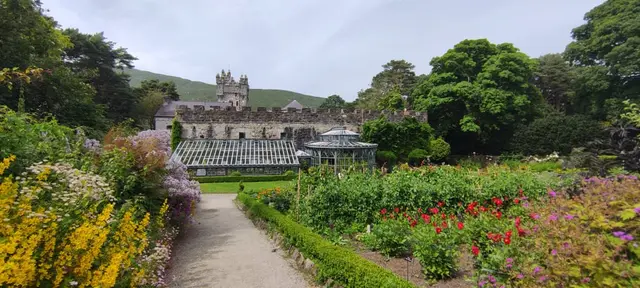 a garden with a building in the background