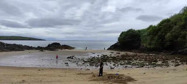 a man standing on a beach