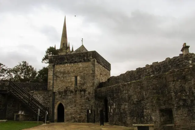 a stone building with a steeple