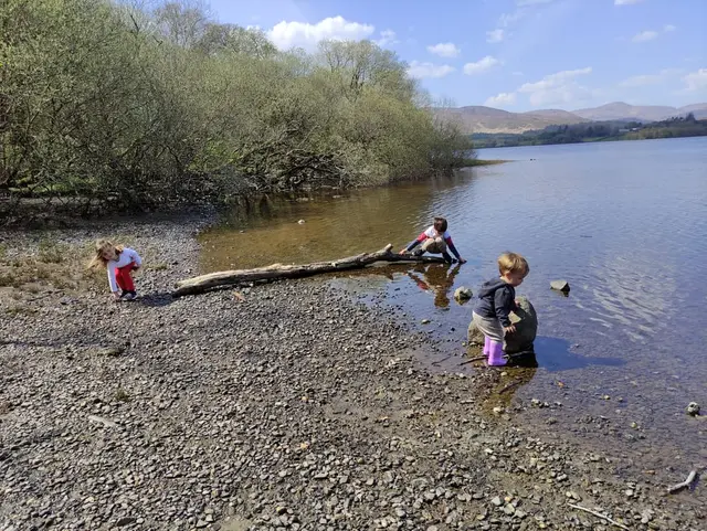 a group of children playing in a river