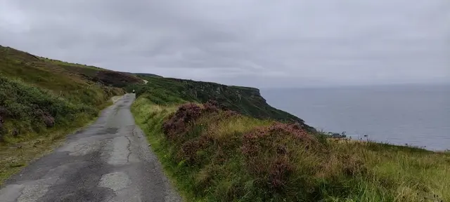 a road on a hill by the water