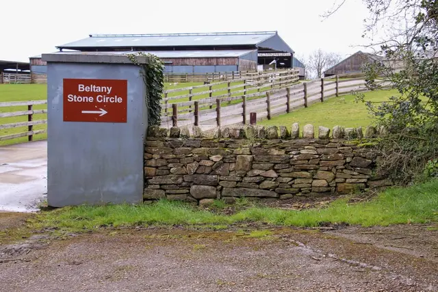 a sign on a stone wall