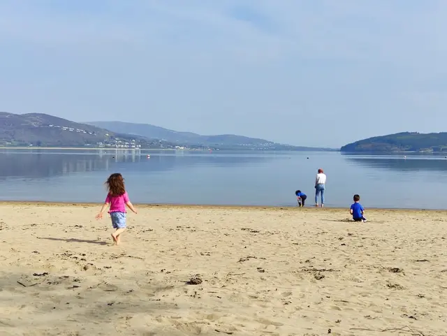 a group of people on a beach