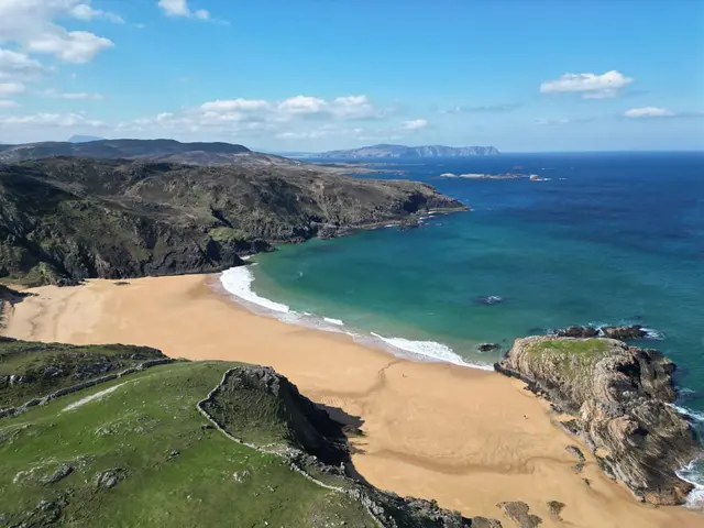 a beach with a body of water