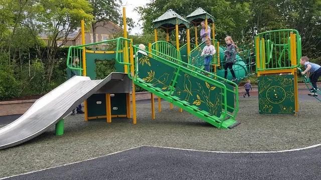 a group of people playing on a playground