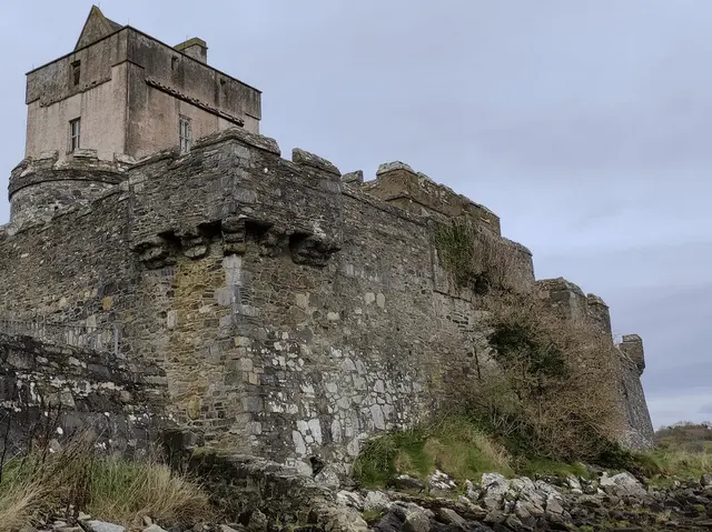 a stone castle on a hill