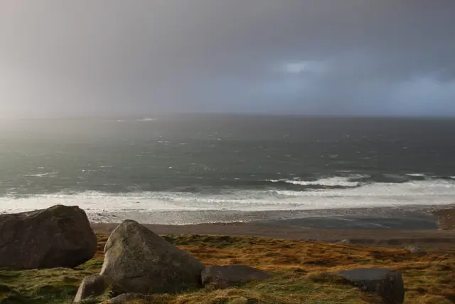 a rocky beach with waves crashing