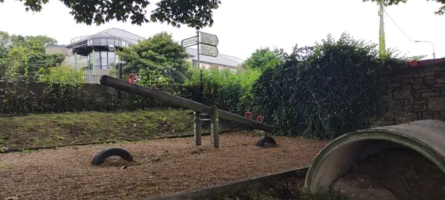 a backyard with a swing set