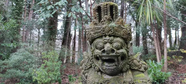 a statue in the woods