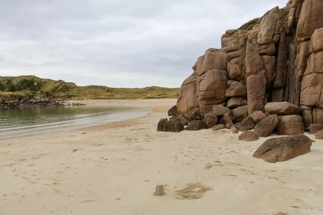 a group of rocks on a beach