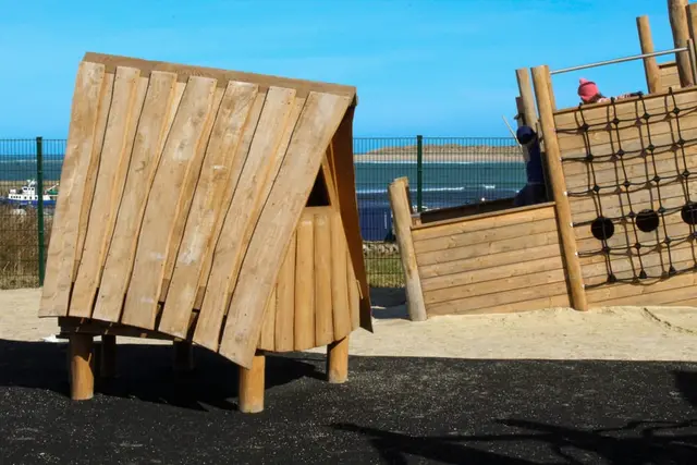 a wooden chair on a deck