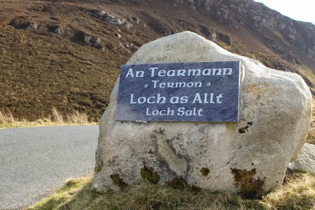 a sign on a rock
