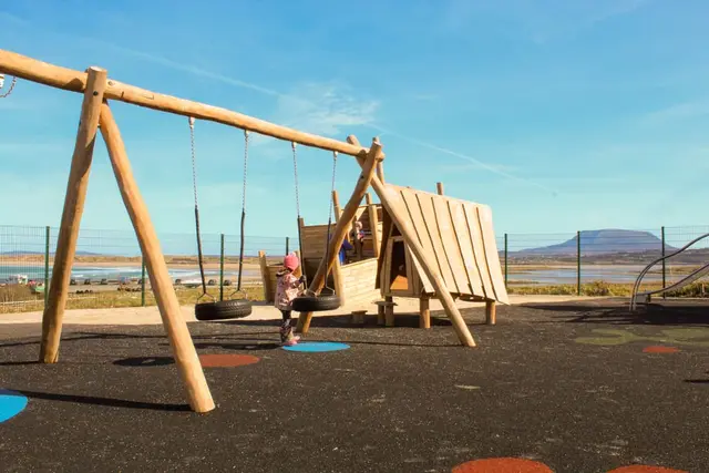 a child on a swing set